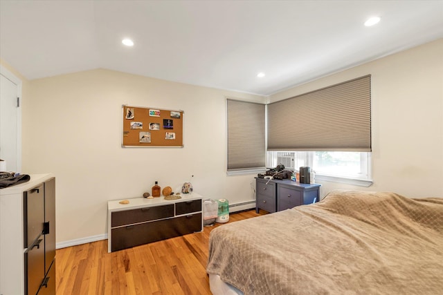 18 Gainsboro Ln, Syosset, NY 11791 - bedroom with a baseboard radiator, wood finished floors, recessed lighting, and lofted ceiling