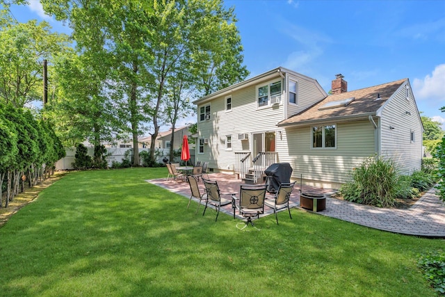 18 Gainsboro Ln, Syosset, NY 11791 - back of house with a patio, a chimney, and a shingled roof