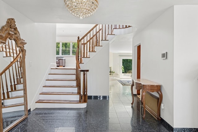 24-56 Little Neck Blvd, Bayside, NY 11360 - staircase featuring granite tiled floors and a chandelier