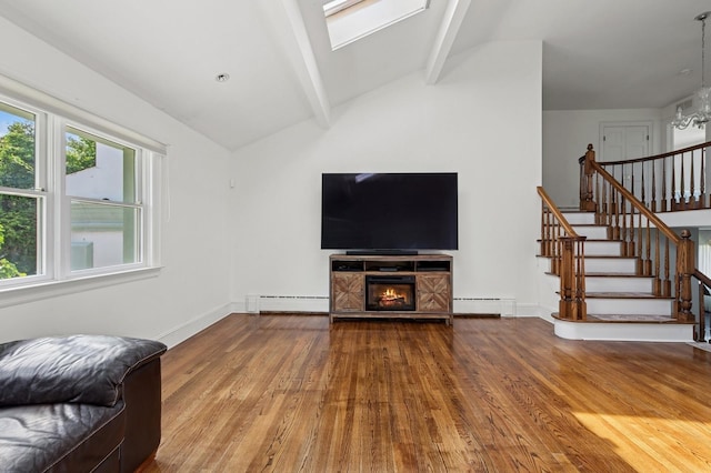 24-56 Little Neck Blvd, Bayside, NY 11360 - unfurnished living room with wood finished floors, a baseboard radiator, stairway, and a chandelier