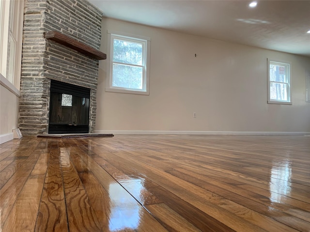 604 Basket Rd, Long Eddy, NY 12760 - unfurnished living room with hardwood / wood-style flooring, a large fireplace, and recessed lighting
