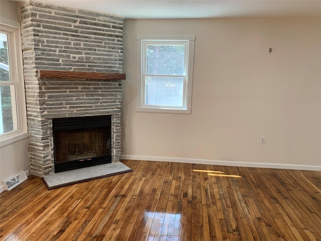604 Basket Rd, Long Eddy, NY 12760 - unfurnished living room featuring hardwood / wood-style floors, a fireplace, and plenty of natural light
