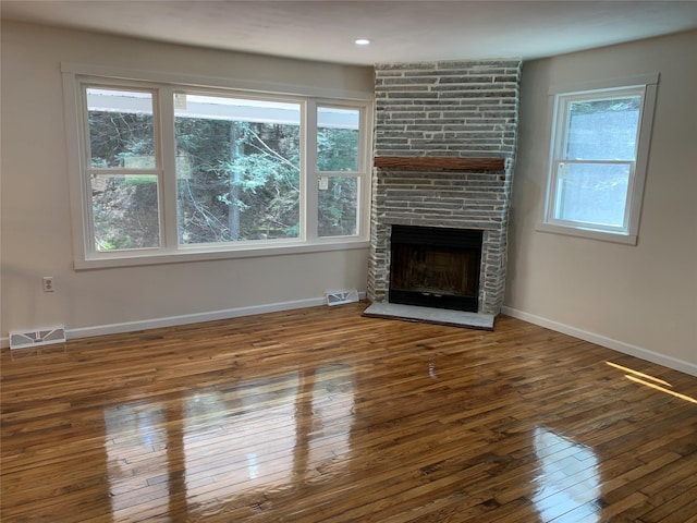 604 Basket Rd, Long Eddy, NY 12760 - unfurnished living room featuring hardwood / wood-style flooring and a fireplace