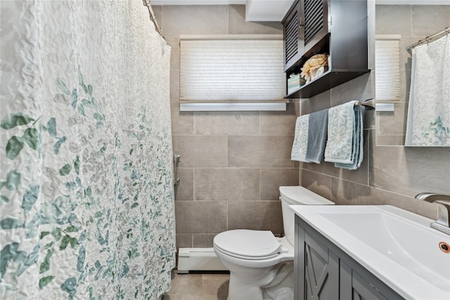 89 3rd Ave, Massapequa Park, NY 11762 - full bathroom with a baseboard radiator, tile walls, vanity, curtained shower, and tile patterned floors
