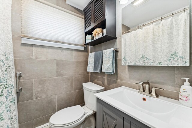89 3rd Ave, Massapequa Park, NY 11762 - full bathroom featuring vanity and tile walls