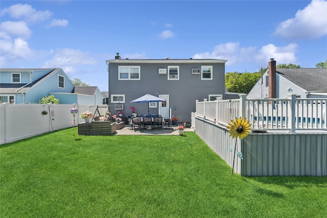 89 3rd Ave, Massapequa Park, NY 11762 - rear view of property featuring a fenced backyard and a patio area