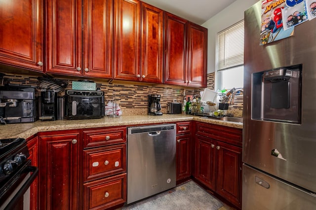 989 Sacket Ave, Bronx, NY 10462 - kitchen with appliances with stainless steel finishes, reddish brown cabinets, tasteful backsplash, and light countertops
