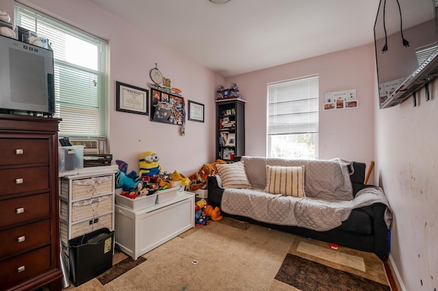 989 Sacket Ave, Bronx, NY 10462 - living area with plenty of natural light, light colored carpet, and cooling unit