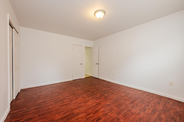 989 Sacket Ave, Bronx, NY 10462 - unfurnished bedroom featuring dark wood-type flooring and baseboards