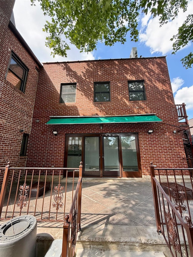 7267 Yellowstone Blvd, Forest Hills, NY 11375 - rear view of house featuring brick siding
