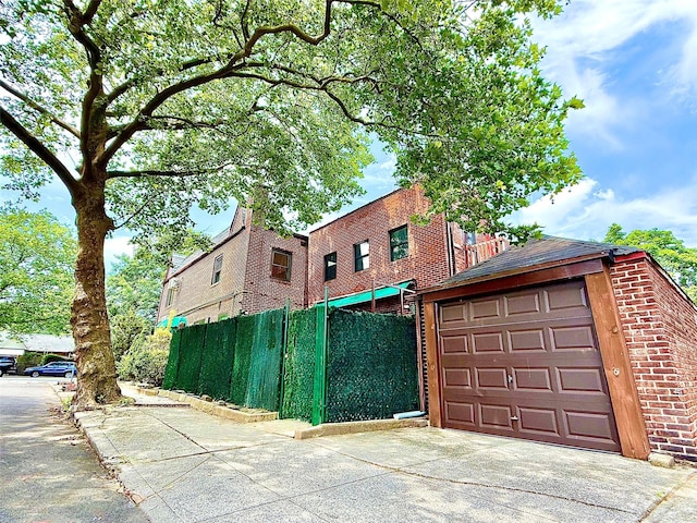 7267 Yellowstone Blvd, Forest Hills, NY 11375 - view of home's exterior with concrete driveway and brick siding