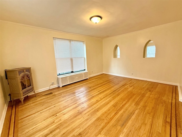 7267 Yellowstone Blvd, Forest Hills, NY 11375 - unfurnished living room with light wood-type flooring and crown molding