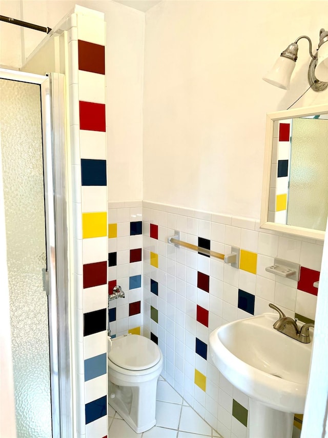 7267 Yellowstone Blvd, Forest Hills, NY 11375 - full bath featuring a stall shower, tile walls, tile patterned floors, and wainscoting