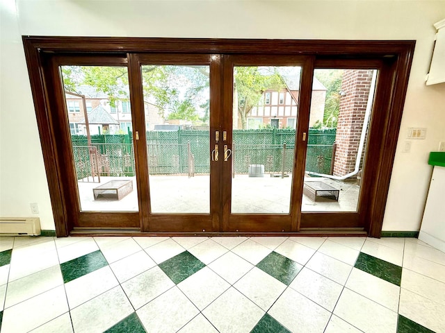 7267 Yellowstone Blvd, Forest Hills, NY 11375 - doorway to outside featuring baseboard heating and light tile patterned flooring