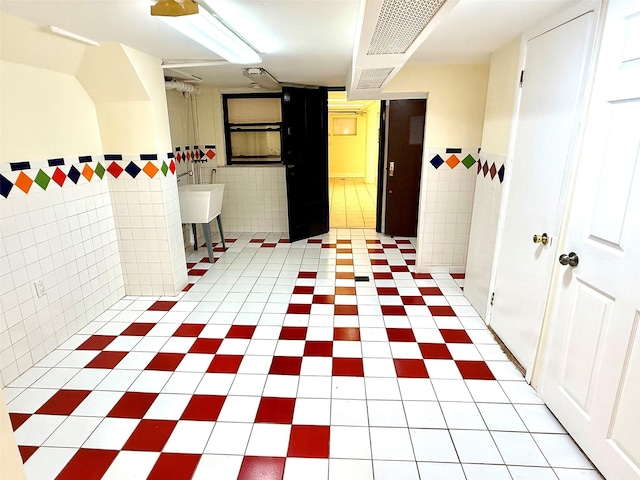 7267 Yellowstone Blvd, Forest Hills, NY 11375 - basement with tile walls and light tile patterned floors