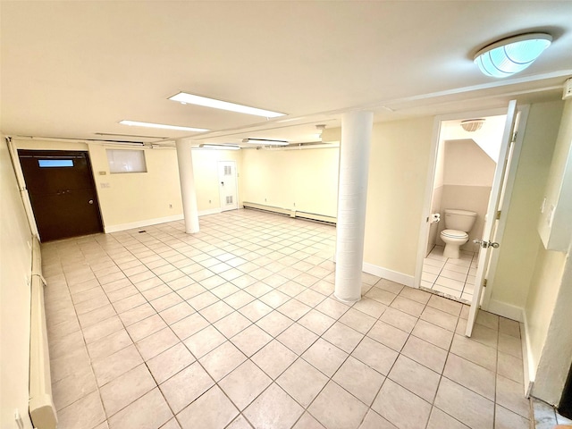 7267 Yellowstone Blvd, Forest Hills, NY 11375 - finished basement with light tile patterned flooring and baseboard heating
