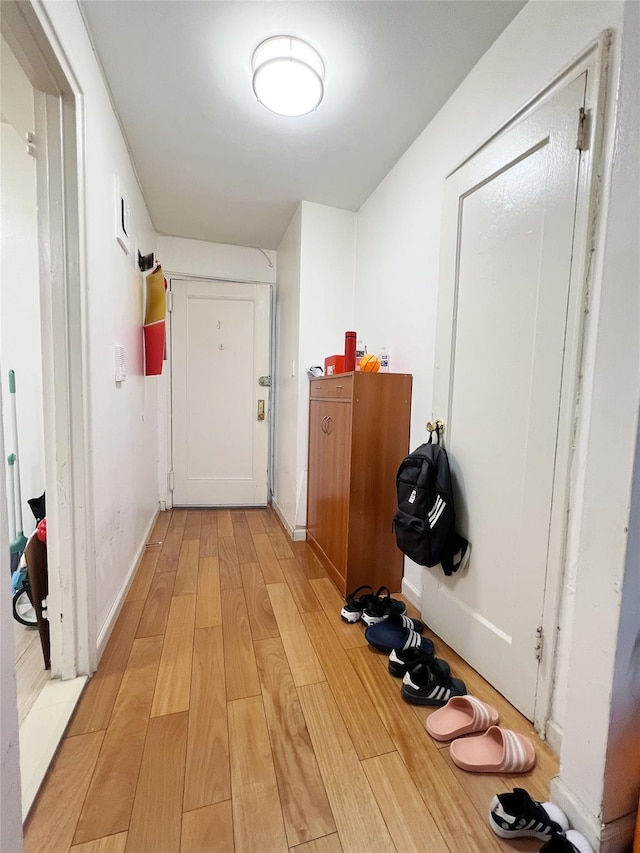 14444 41st Ave Unit 1M, Flushing, NY 11355 - hallway with light wood-style floors and baseboards