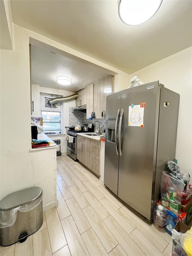 14444 41st Ave Unit 1M, Flushing, NY 11355 - kitchen with stainless steel appliances, light countertops, and backsplash
