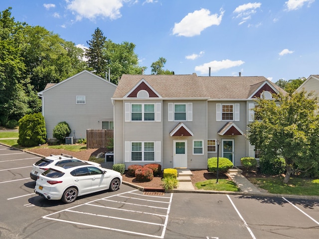 256 Quassaick Ave Unit 17, New Windsor, NY 12553 - view of front of home featuring uncovered parking and a shingled roof
