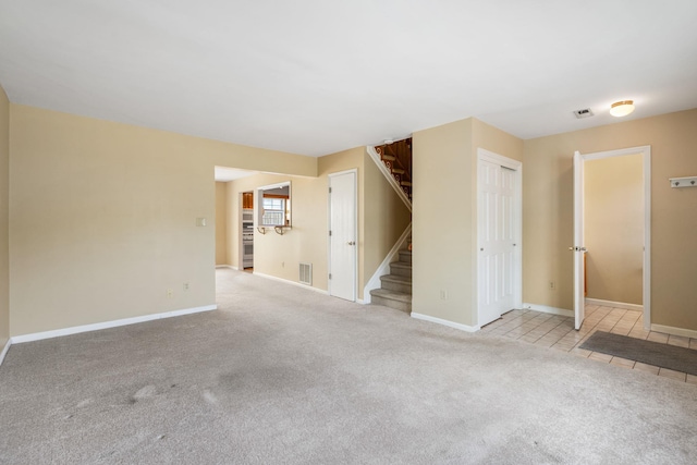 256 Quassaick Ave Unit 17, New Windsor, NY 12553 - unfurnished room featuring stairs and carpet