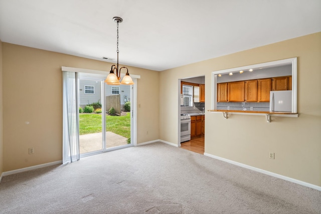 256 Quassaick Ave Unit 17, New Windsor, NY 12553 - unfurnished dining area featuring light colored carpet and baseboards
