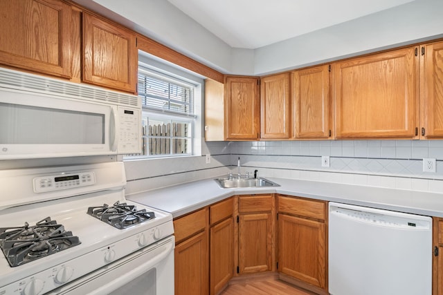 256 Quassaick Ave Unit 17, New Windsor, NY 12553 - kitchen featuring white appliances, light countertops, decorative backsplash, and brown cabinetry