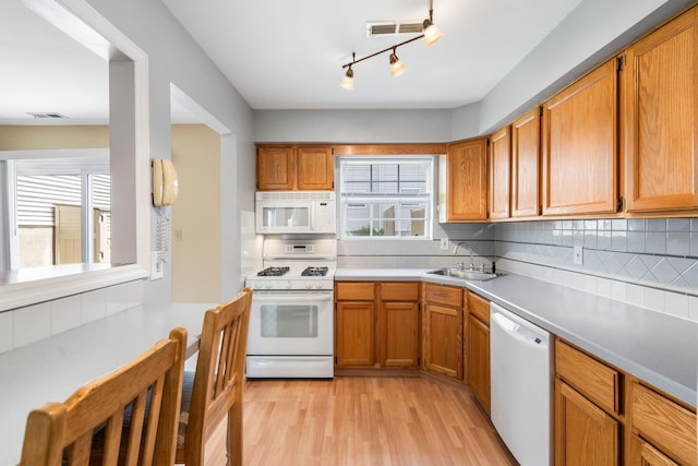 256 Quassaick Ave Unit 17, New Windsor, NY 12553 - kitchen with white appliances, healthy amount of natural light, light wood finished floors, and tasteful backsplash