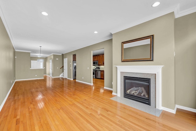 2509 Sylvan Loop, Wappingers Falls, NY 12590 - unfurnished living room featuring light wood-style floors, recessed lighting, a fireplace with flush hearth, ornamental molding, and stairs