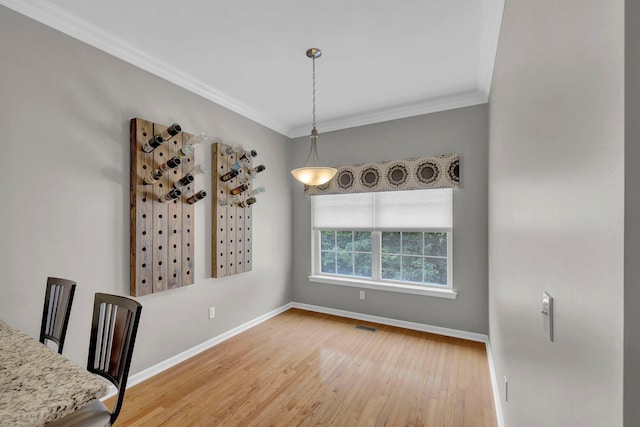 2509 Sylvan Loop, Wappingers Falls, NY 12590 - unfurnished dining area with crown molding and light wood finished floors