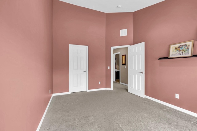 2509 Sylvan Loop, Wappingers Falls, NY 12590 - unfurnished bedroom with a towering ceiling and carpet floors