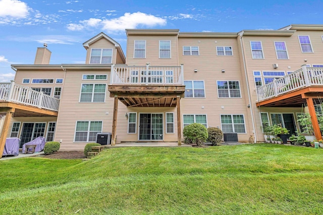 2509 Sylvan Loop, Wappingers Falls, NY 12590 - back of property featuring a chimney and a lawn