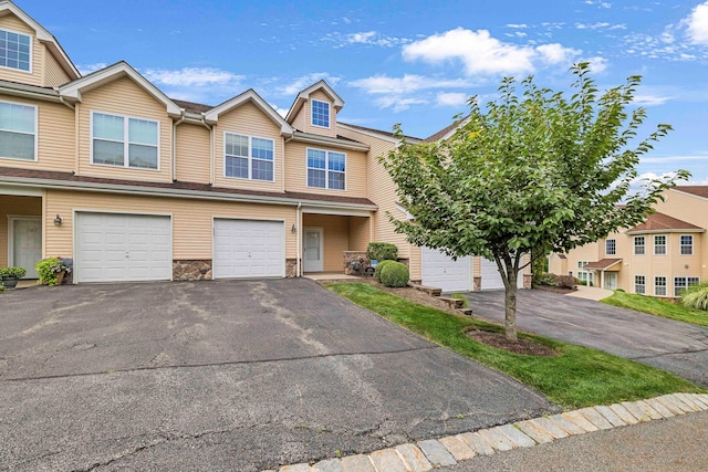 2509 Sylvan Loop, Wappingers Falls, NY 12590 - view of property with driveway, an attached garage, and stone siding