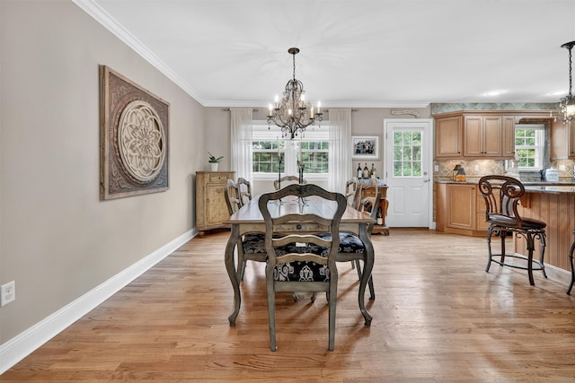 69 Oakland Pl, Nanuet, NY 10954 - dining space featuring a chandelier, ornamental molding, and light wood finished floors