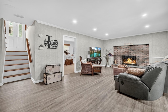 69 Oakland Pl, Nanuet, NY 10954 - living room featuring healthy amount of natural light, wood finished floors, stairway, crown molding, and recessed lighting