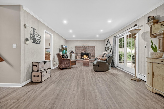 69 Oakland Pl, Nanuet, NY 10954 - living area featuring crown molding, wood finished floors, a fireplace, recessed lighting, and a baseboard heating unit