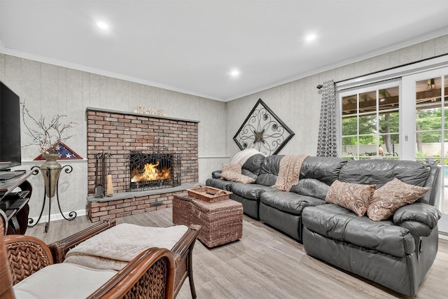 69 Oakland Pl, Nanuet, NY 10954 - living area featuring wood finished floors, a fireplace, ornamental molding, and recessed lighting