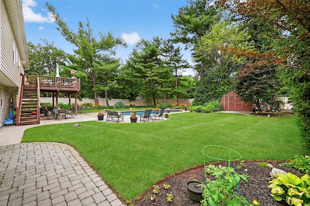 69 Oakland Pl, Nanuet, NY 10954 - fenced backyard featuring a storage unit, stairs, a wooden deck, and a patio area