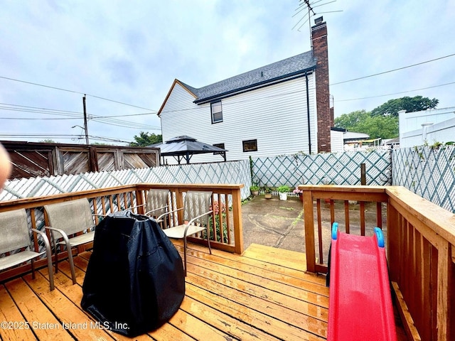 3516 Fillmore Ave, Brooklyn, NY 11234 - wooden terrace with a fenced backyard and a gazebo