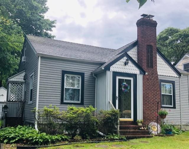 36 Lou Ave, Kings Park, NY 11754 - bungalow-style home with a chimney