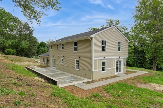 24 Sol Dr, Carmel, NY 10512 - rear view of house with french doors and a patio