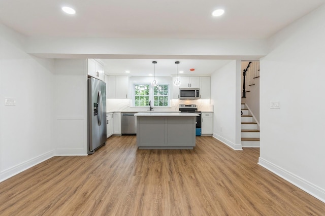 24 Sol Dr, Carmel, NY 10512 - kitchen featuring stainless steel appliances, a kitchen island, white cabinets, light countertops, and recessed lighting