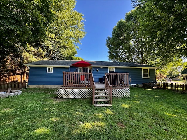 18 Amherst Rd, Red Hook, NY 12571 - back of property featuring a wooden deck and a fire pit