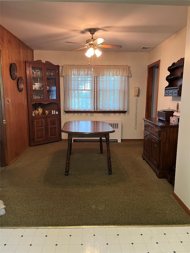 11 Crescent Dr, Cortlandt Manor, NY 10567 - dining room featuring carpet flooring, ceiling fan, radiator, and wooden walls
