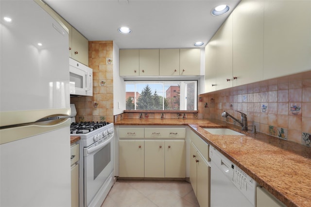 10Stewart Place 3Hw, White Plains, NY 10601 - kitchen with white appliances, decorative backsplash, recessed lighting, cream cabinets, and light tile patterned floors