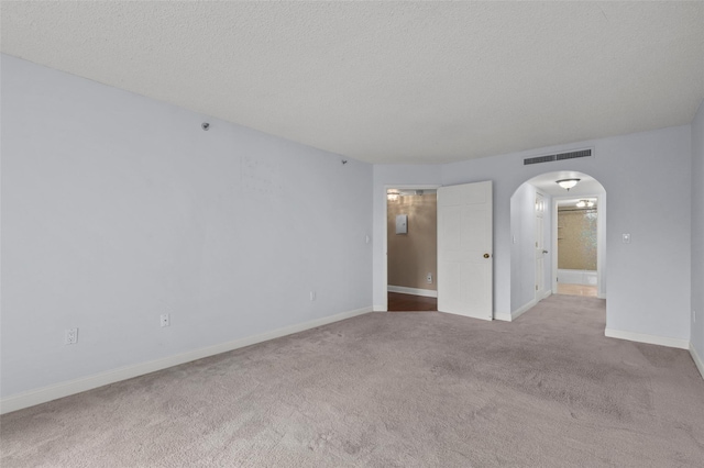 10Stewart Place 3Hw, White Plains, NY 10601 - carpeted spare room with arched walkways and a textured ceiling