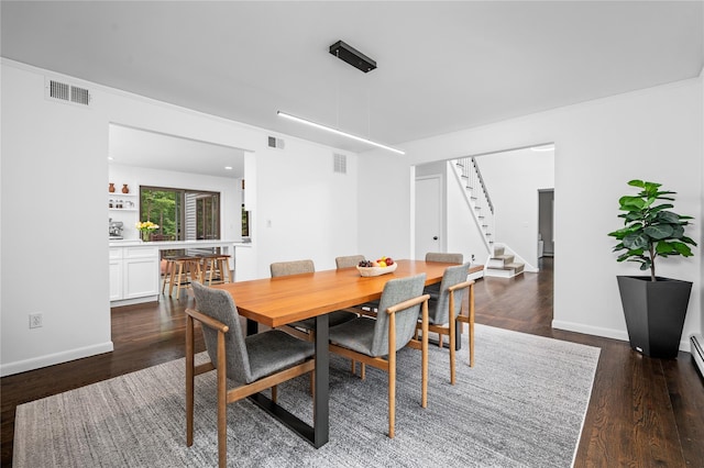 32 Pine Dr, Pound Ridge, NY 10576 - dining space with stairway and dark wood-style floors