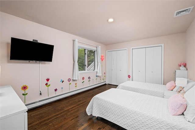 32 Pine Dr, Pound Ridge, NY 10576 - bedroom featuring a baseboard heating unit, two closets, dark wood-style floors, and recessed lighting