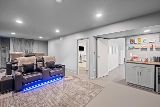 32 Pine Dr, Pound Ridge, NY 10576 - home theater featuring a bar, recessed lighting, concrete floors, and beverage cooler