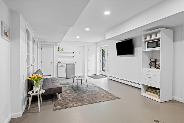 32 Pine Dr, Pound Ridge, NY 10576 - living area featuring a baseboard radiator, concrete flooring, and recessed lighting
