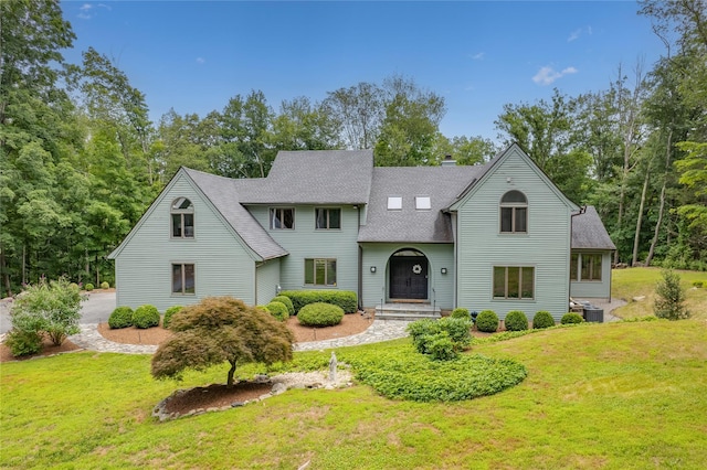 32 Pine Dr, Pound Ridge, NY 10576 - view of front of property with roof with shingles, a front lawn, and a chimney